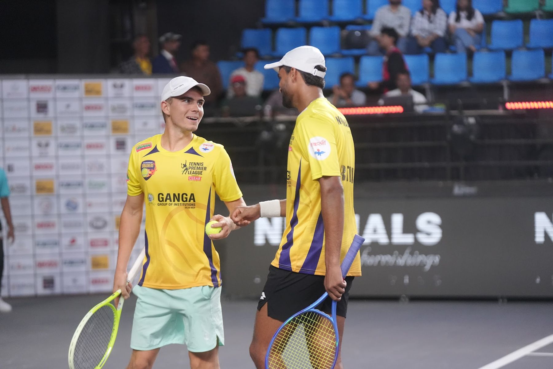 Tennis Premier League doubles partners celebrating a point (previous season)