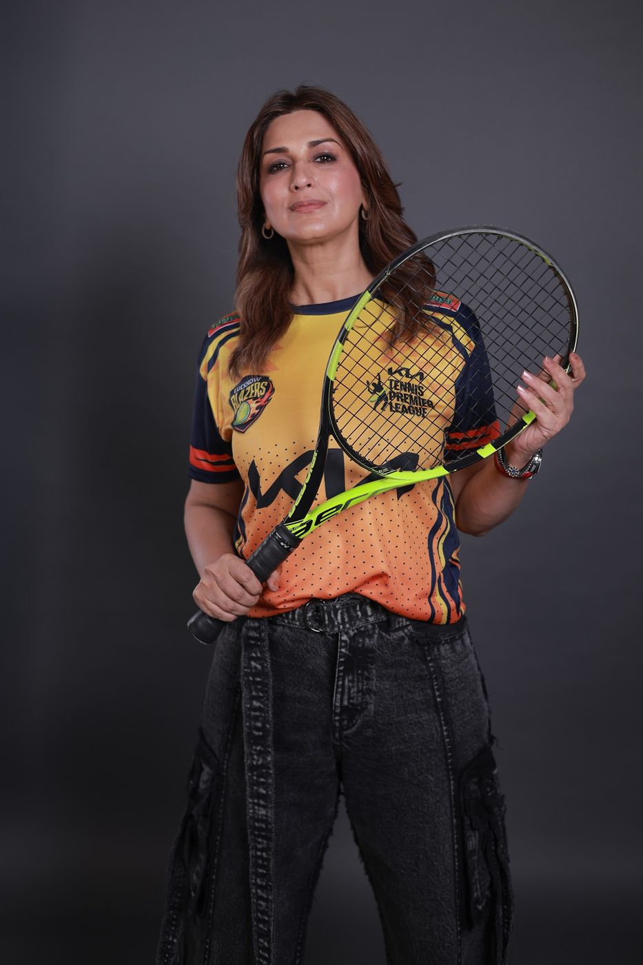 Sonali Bendre, Lucknow Blazers co-owner, in the new Season 8 jersey with a tennis racket
